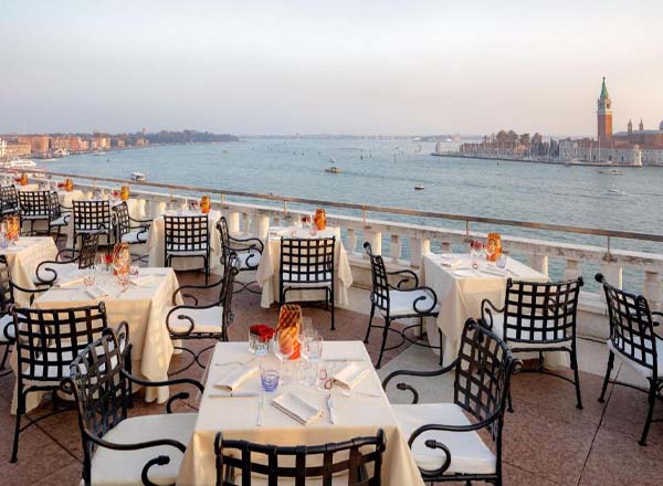 Terrazza Danieli rooftop restaurant terrace overlooking the Venetian lagoon at sunset